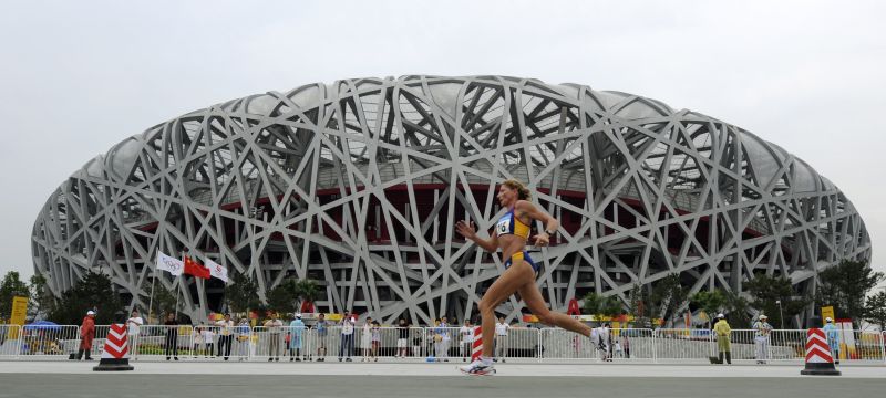 Tomescu of Romania runs past the National Stadium during the women's marathon of the Beijing 2008 Olympic Games